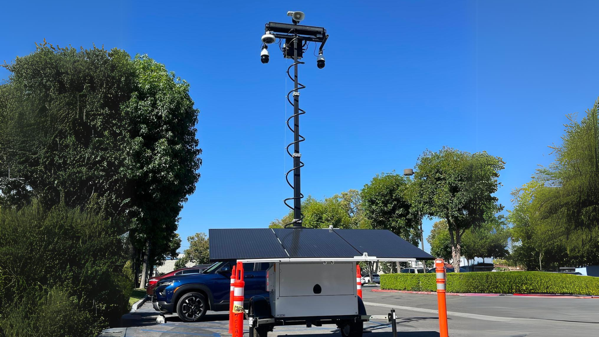 A mobile surveillance trailer equipped with a solar-powered security camera, ideal for enhancing security in remote areas.