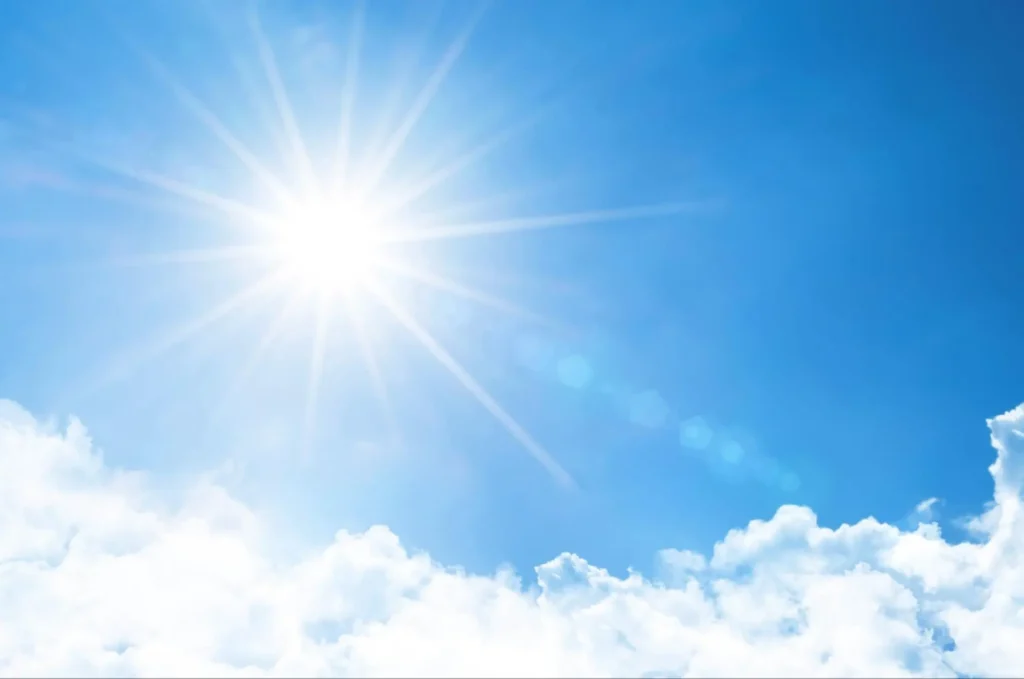Solar-Powered Security Solutions | ASF Bright sun in a blue sky representing solar-powered security solutions from American Security Force