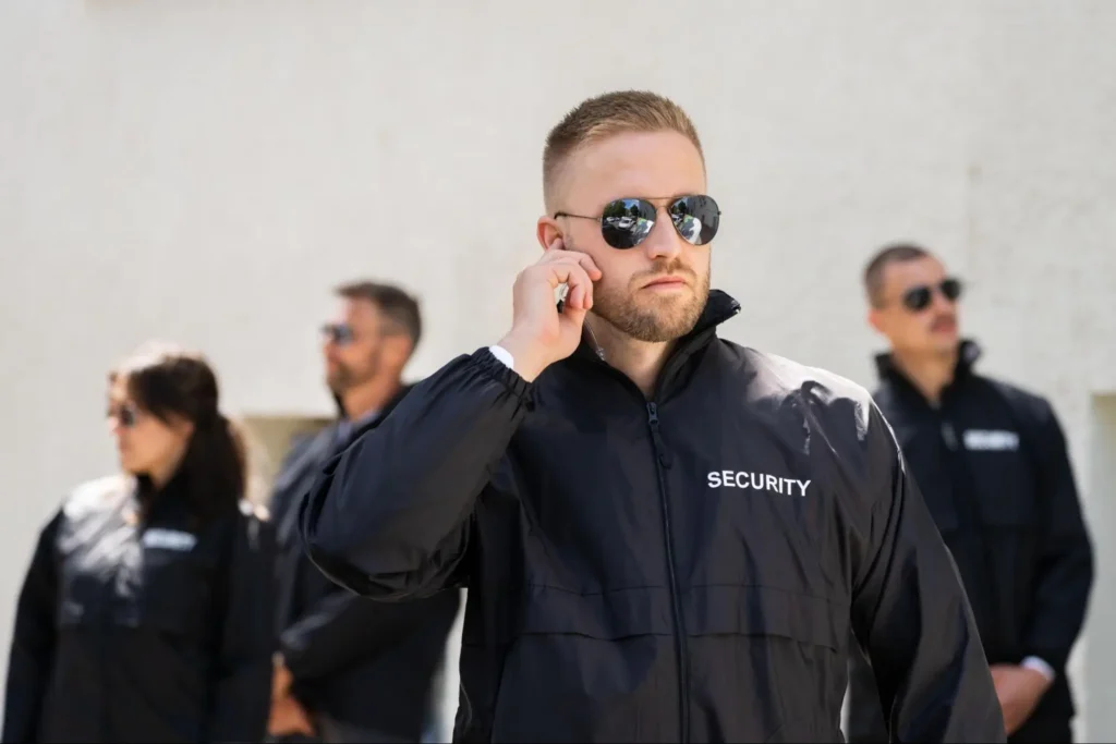 American Security Force executive protection team wearing security jackets and monitoring a site