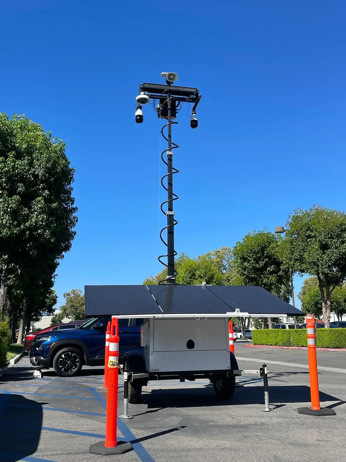 Mobile Solar Security Camera Trailer for Parking Lot Protection | ASF Mobile solar security camera trailer with surveillance cameras for parking lot protection by American Security Force