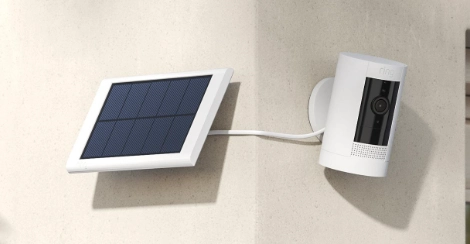 Solar-Powered Wireless Security Camera Installation Services | American Security Force Solar-powered wireless outdoor security camera mounted on exterior wall for residential surveillance by American Security Force